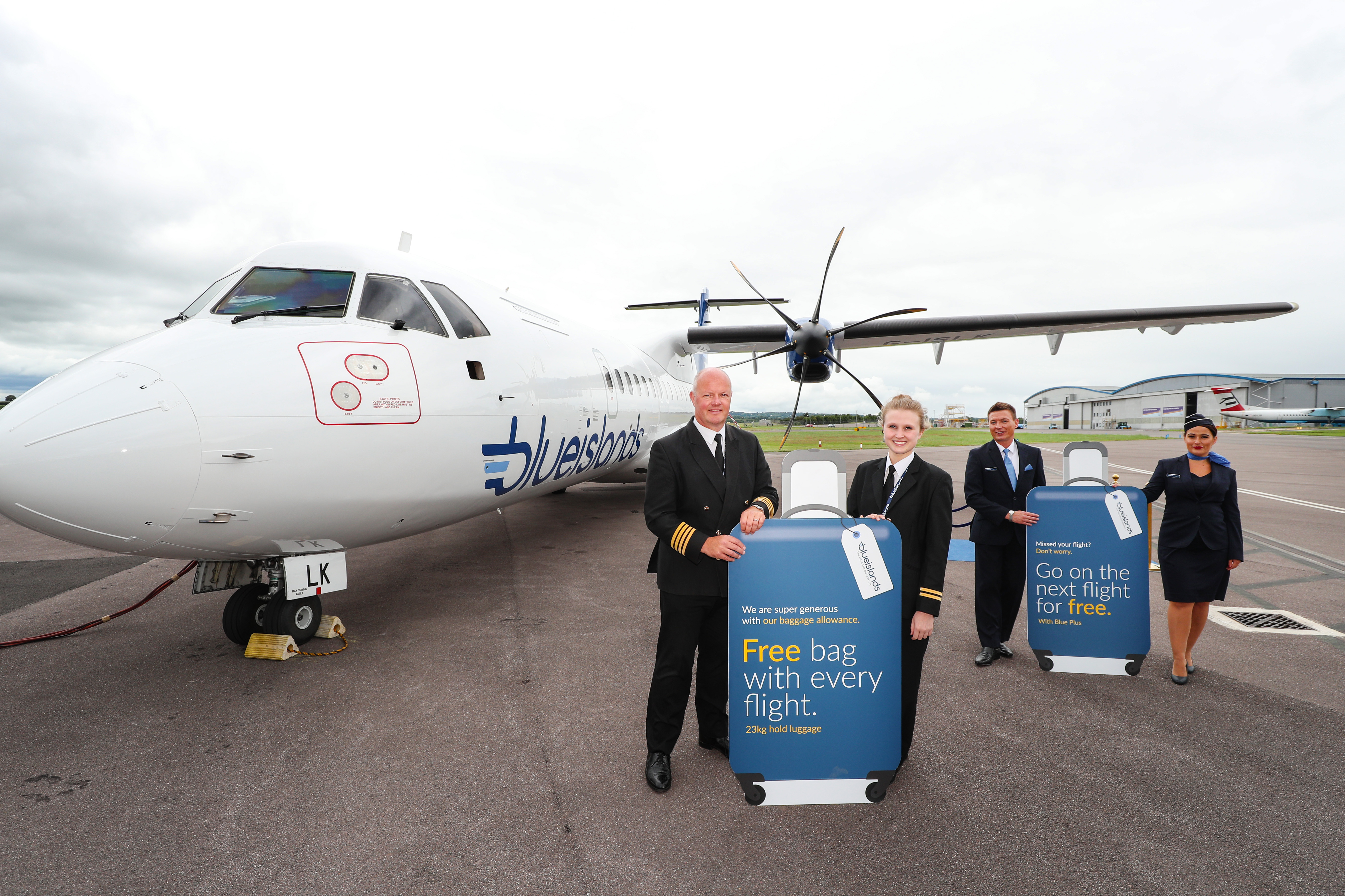 Blue Islands student hold luggage offer Guernsey Airport